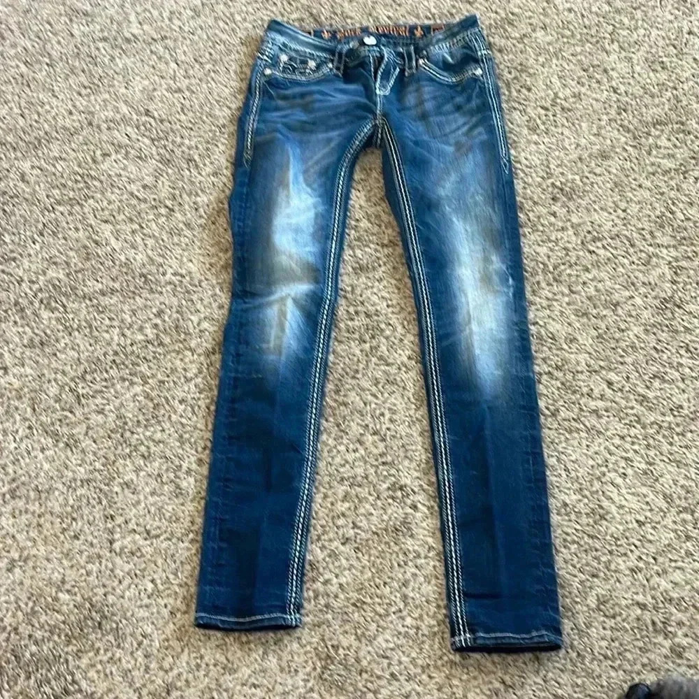 Rock Revival Women's Skinny Jeans in Dark Blue with Fading